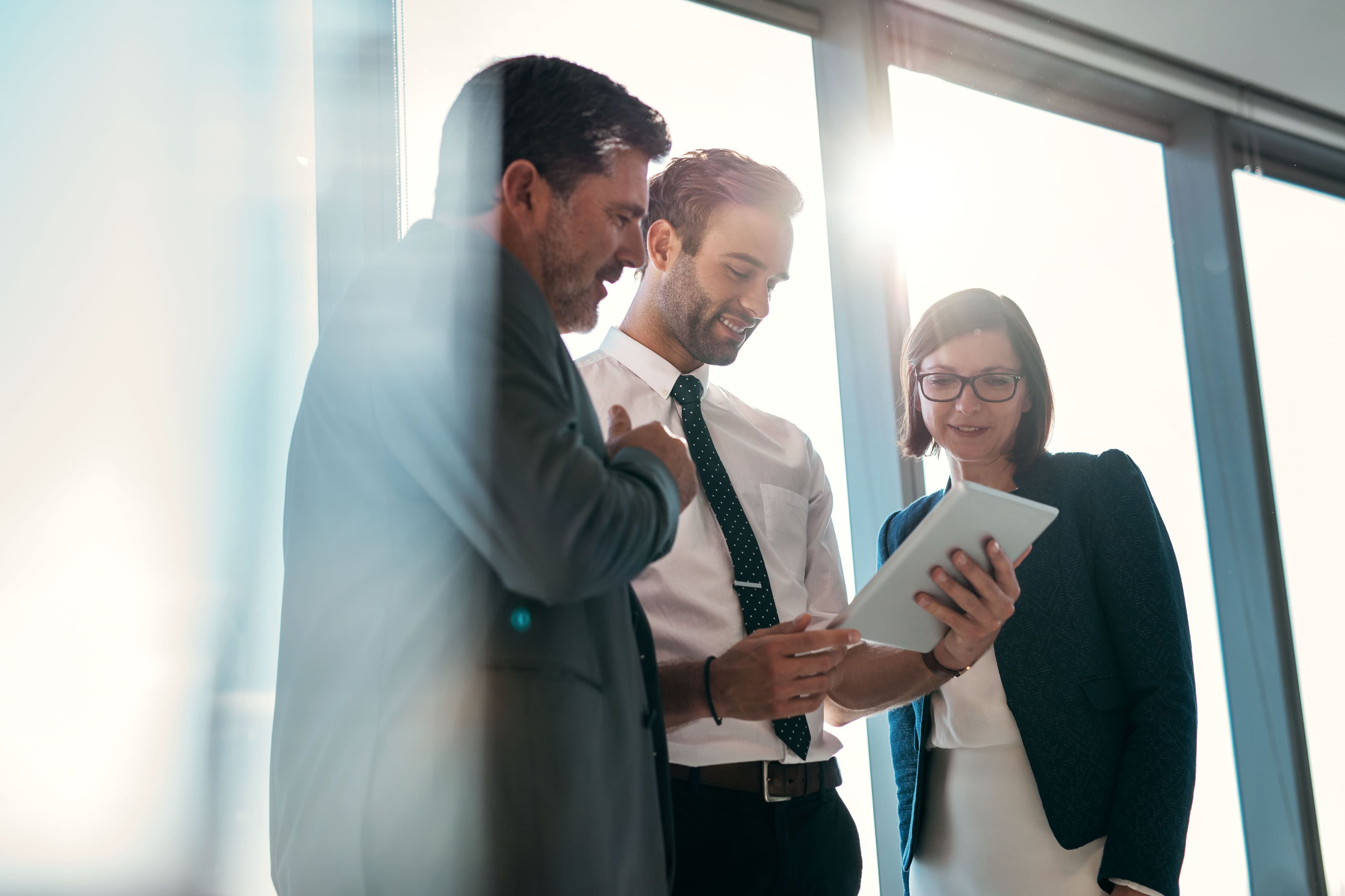 business partners looking in a tablet